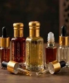 Gold-capped oudh attar bottles and droppers